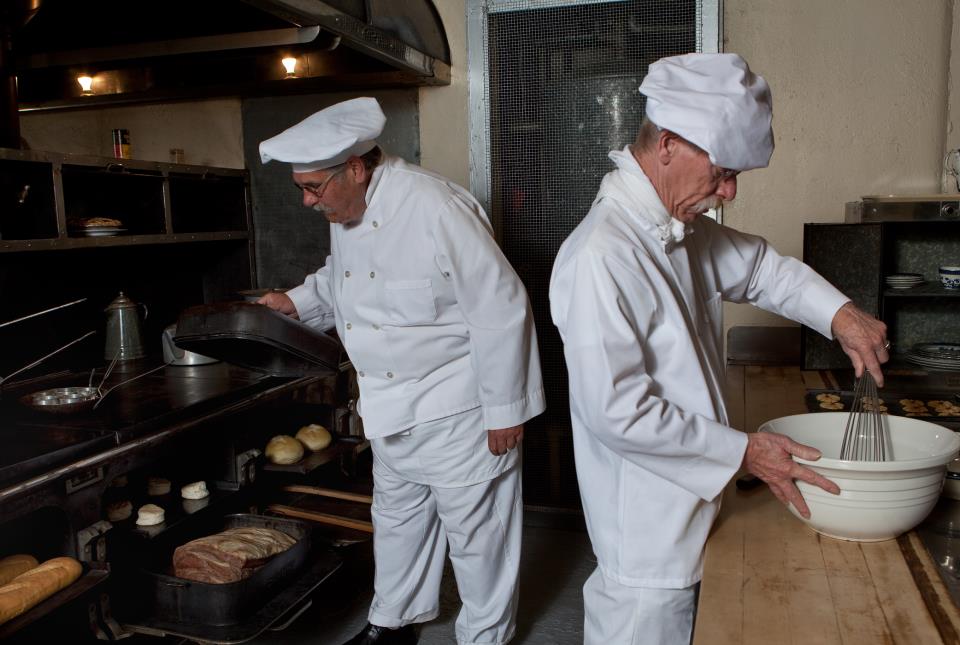 Chefs cooking in the Hearst Castle kitchen during the Evening Tour